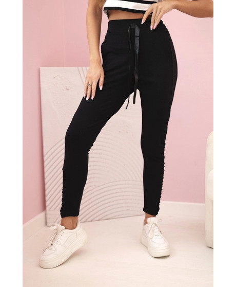 Dámske nohavice s volánom na bokoch